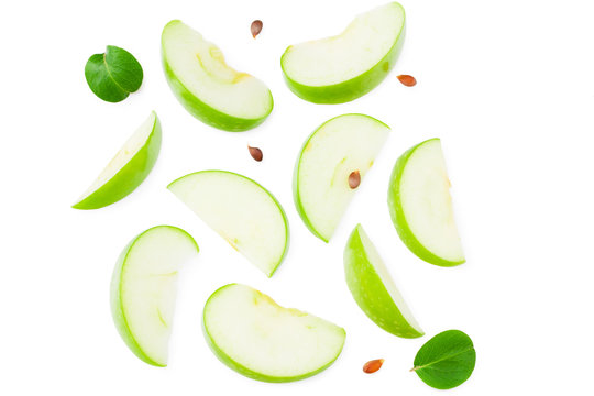 piece of green apple with green leaves isolated on white background. top view