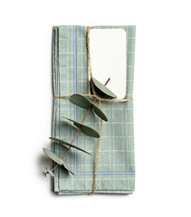 Beautiful napkin with floral decor and card on white background