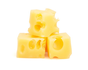 Many pieceses of cheese on white