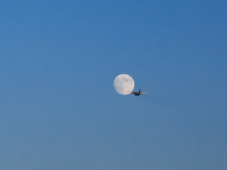 airplane flying to the moon