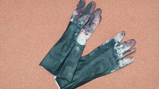 Safety Gloves being set over a cork surface