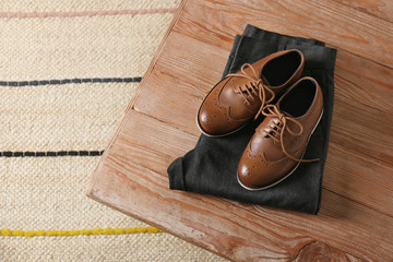 Stylish school uniform on wooden table