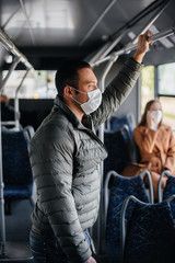 Passengers on public transport during the coronavirus pandemic keep their distance from each other....