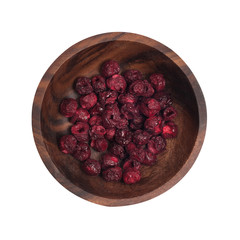 dried cherry in a brown wooden plate.