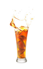 Glass of tasty cold ice tea with splash on white background