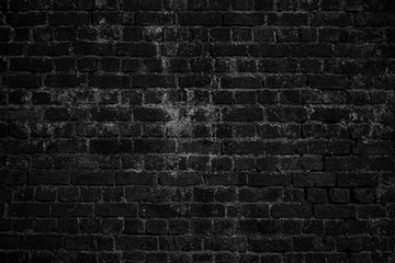 Black grunge brick urban wall.