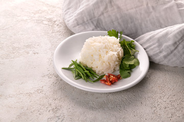portion of rice seasoned with greens and red pepper