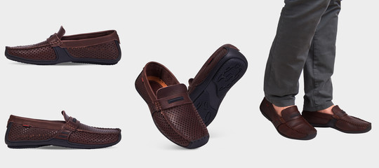 Men's brown leather summer loafers with perforation and black sole. Isolated on a white background.