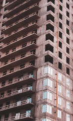 Close-up of a skyscraper with a view of the balconies, modern construction technology