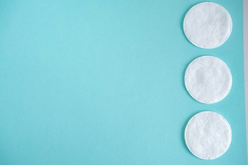 Cotton pads on pink background
