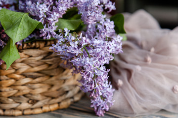 The beautiful lilac flowers in basket