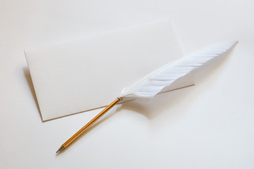 white envelope on a white background, vintage pen with a pen, receiving and sending letters by mail, retro style