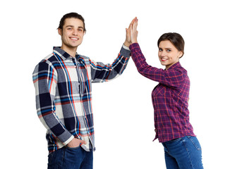 Photo of happy young people man and woman in basic clothing give fife isolated over white background