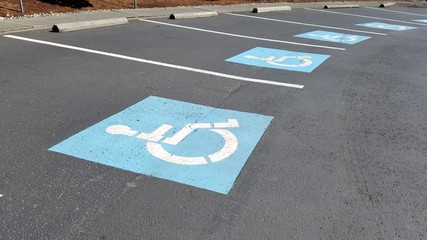 Multiple handicapped sign parking lot on the street