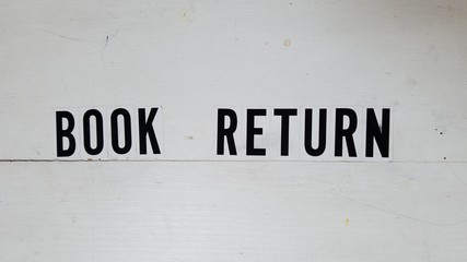 Book return sign on the self-service box in library