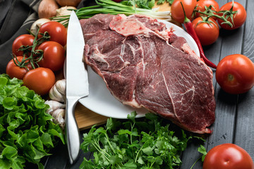 A juicy piece of fresh meat. Meat and vegetables. Cooking meat. A chef's knife. Balanced diet. Red meat.
