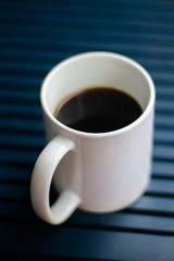 White Coffee Mug  on Blue Table