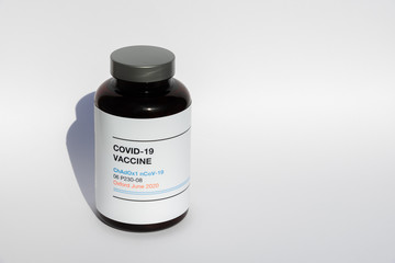 a brown bottle from Oxford with the new  Vaccine ChAdOx1 nCoV-19