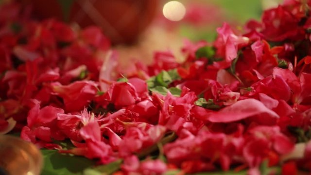 Wedding ceremony, traditional indian hindu marriage ritual with red flowers and attributes
