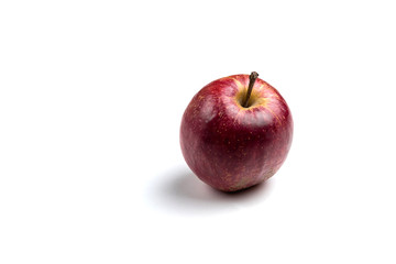 A ripe red Apple isolated on a white background. Organic product. Agricultural industry. Beautiful shiny Apple