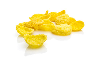 Breakfast cereal corn flakes on white. Cereal Healthy Cornflakes - snack breakfast best with milk. Dieting and detoxication concept with mineral nutrients. Macro close-up shot.