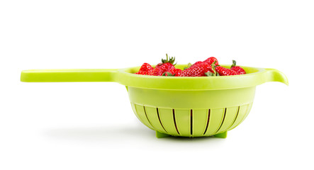 Fresh ripe strawberries in colander