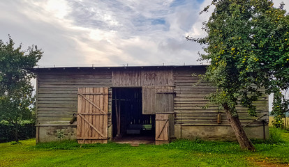 Fototapeta na wymiar Old barn in Polish village - Choczewo, Pomerania, Poland