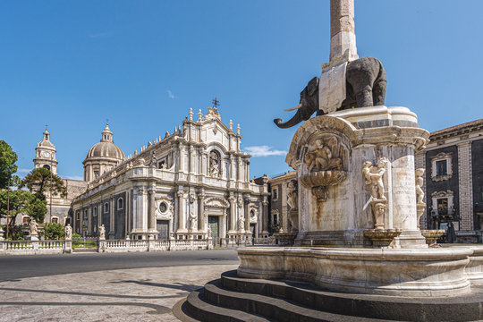 Catania, Sicily (Italy). Dome square and the fountain of the elephant (1737) main landmark of the city with the Cathedral of Saint Agatha in the background.