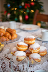 Christmas table with croissants and donuts