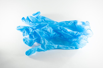 disposable blue medical gloves on a white background