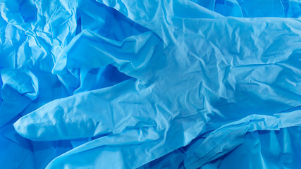 disposable blue medical gloves on a white background