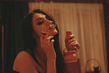 Beautiful brunette caucasian girl with long hair posing indoors. Style, fashion trends concept.