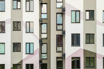 Detail facade with windows. Simple high-rise residential typical building.