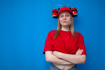 young brutal girl fan is standing confidently on a blue background