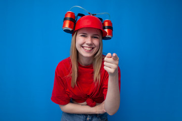 girl fan shows a finger at the camera and taunts, a cheerleader makes fun