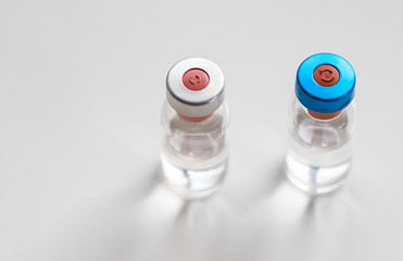 close up on vaccine and medical syringe
