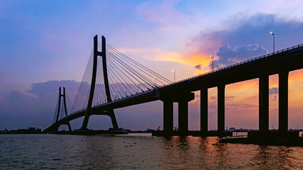 Fototapeta na wymiar Vam Cong Bridge at sunset (Can Tho, Vietnam)