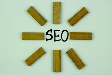 SEO, the concept of search engine optimization, the idea of promoting traffic to the site. Wooden blocks.