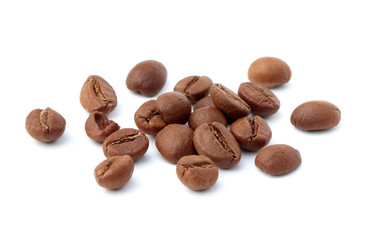 Roasted coffee beans isolated on a white background. Heap of coffee beans isolated