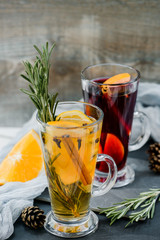 mulled red and white wine wirh spices on dark stone background