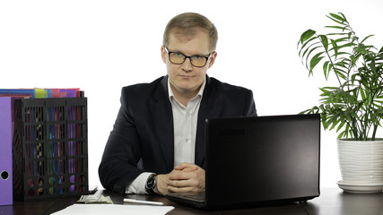 Businessman director in office leaning on table looking at camera and smile