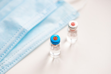 close up on vaccine and medical syringe