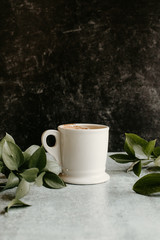 cup of coffee with leaves