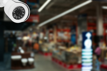 Fototapeta premium Modern CCTV security camera in shopping mall. Guard equipment