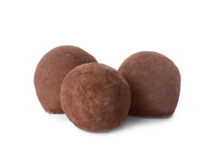 Delicious chocolate truffle candies isolated on white