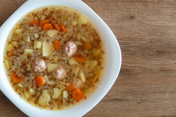 Clear Soup with Vegetables and Meatballs. Top view.