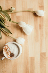 Fototapeta na wymiar coffee tulips wooden background