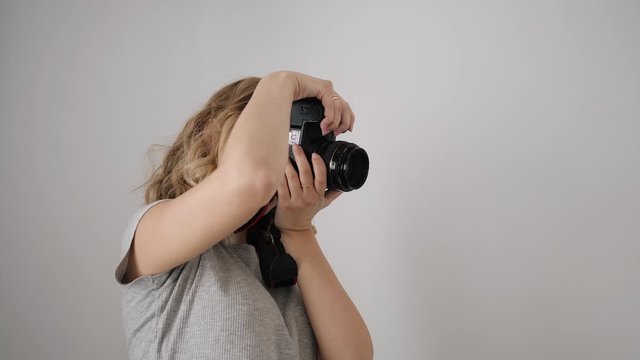 young woman photographer teaches the model to pose