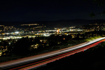 Fototapeta na wymiar Freeway Lights with City