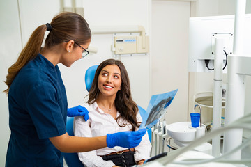 Happy patient in dental clinic relived that x-ray result is good